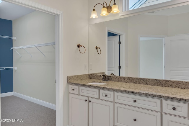 149 Kings Creek Dr, Bluffton, SC 29909 - bathroom featuring vanity, a chandelier, baseboards, and a walk in closet