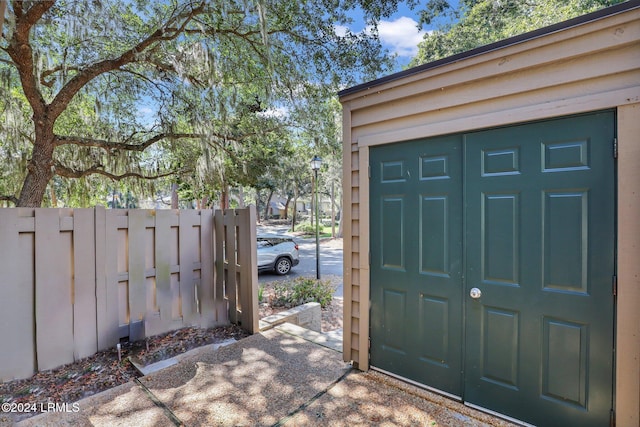 view of gate with an outdoor structure