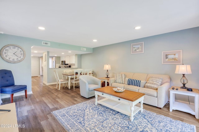 living room featuring light wood-type flooring