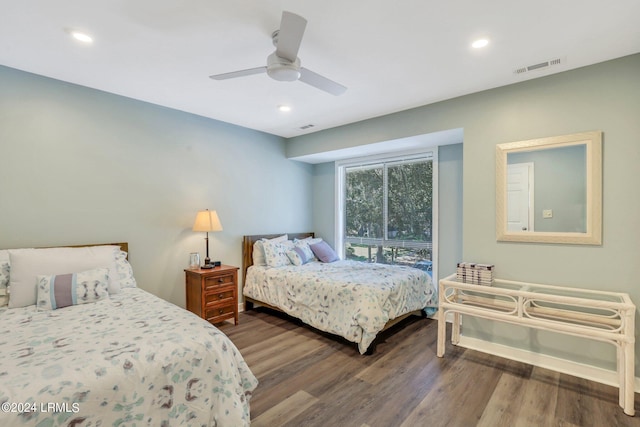 bedroom with hardwood / wood-style floors and ceiling fan