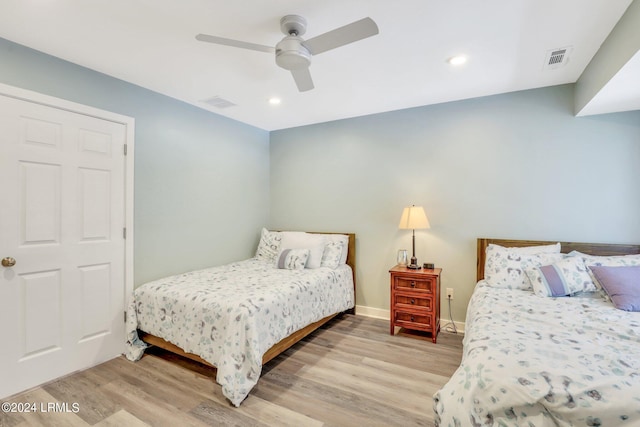 bedroom with ceiling fan and light wood-type flooring