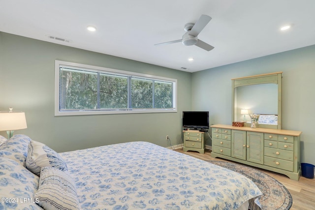 bedroom featuring light wood-type flooring and ceiling fan