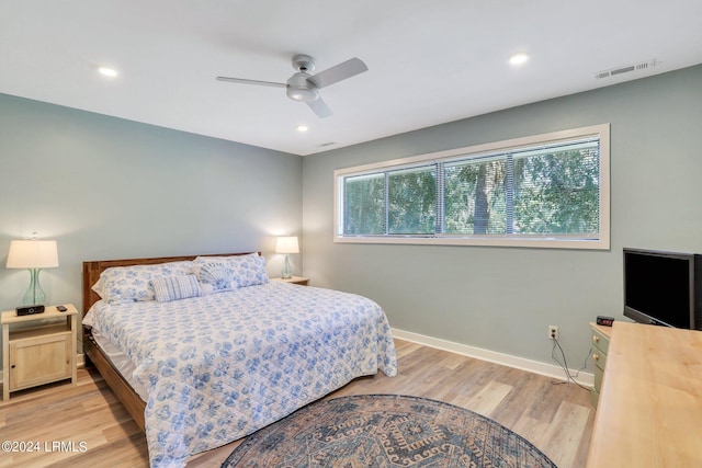 bedroom featuring ceiling fan and light hardwood / wood-style flooring