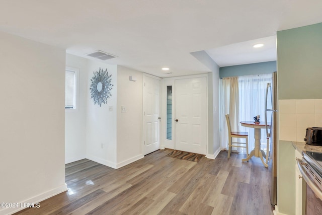 entrance foyer with light hardwood / wood-style flooring