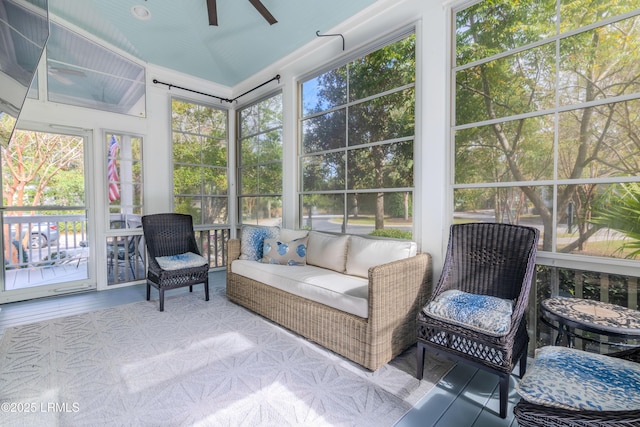 sunroom / solarium with vaulted ceiling and ceiling fan