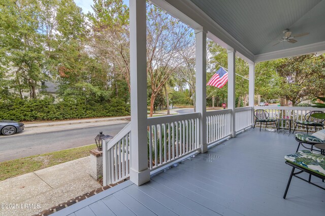 wooden deck with a ceiling fan and covered porch