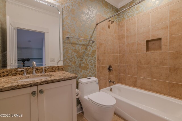 bathroom with bathing tub / shower combination, toilet, ornamental molding, vanity, and wallpapered walls