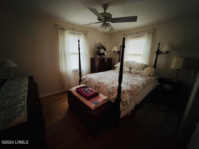 bedroom featuring dark wood-type flooring and ceiling fan