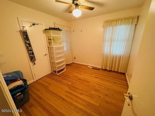 unfurnished room with ceiling fan and light hardwood / wood-style flooring