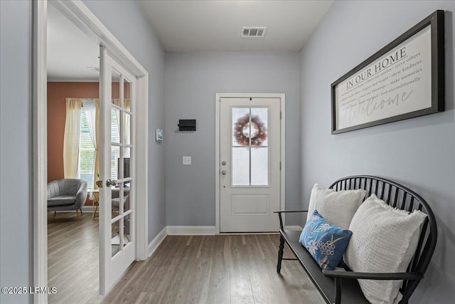 114 Danner Dr, Bluffton, SC 29909 - entryway with light wood-style floors, baseboards, and french doors
