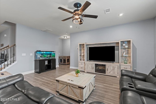 114 Danner Dr, Bluffton, SC 29909 - living room featuring ceiling fan, light wood-type flooring, stairway, baseboards, and recessed lighting
