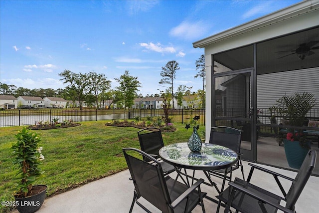 114 Danner Dr, Bluffton, SC 29909 - view of patio / terrace with a water view, outdoor dining space, a residential view, and a sunroom
