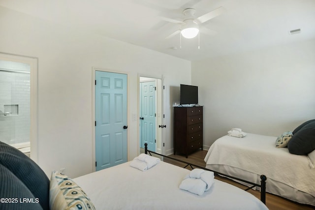 bedroom with dark wood-type flooring and ceiling fan