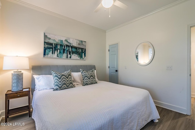 bedroom featuring crown molding, ceiling fan, and hardwood / wood-style floors