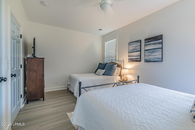 bedroom featuring ceiling fan and light wood-type flooring