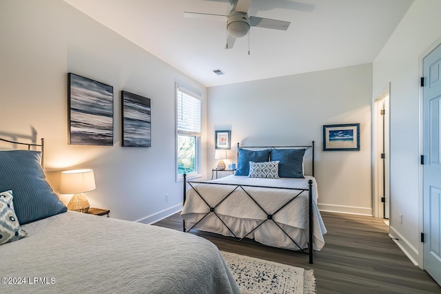 bedroom with dark wood-type flooring and ceiling fan