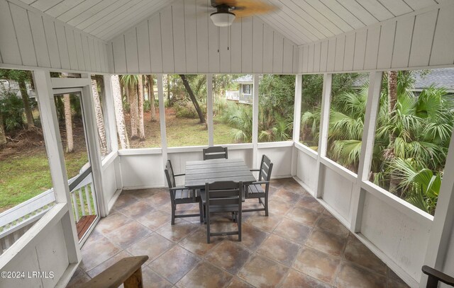 sunroom with lofted ceiling and ceiling fan