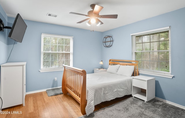 bedroom featuring wood-type flooring and ceiling fan