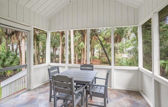 sunroom featuring lofted ceiling