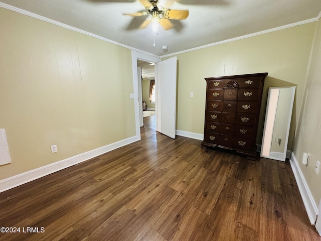 unfurnished bedroom featuring crown molding, ceiling fan, and dark wood-type flooring