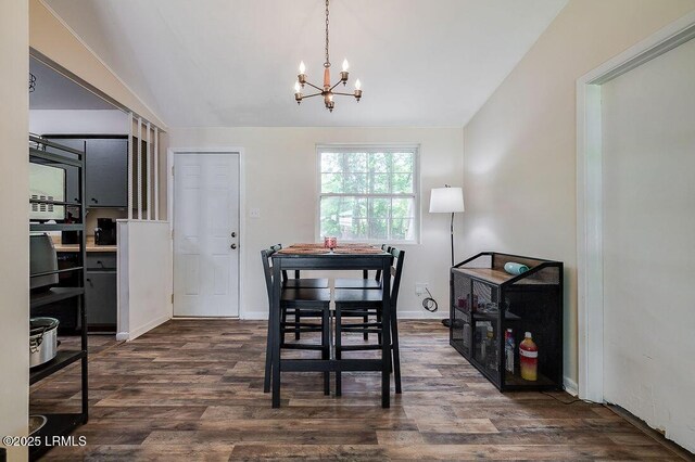 12408 Deerfield Rd, Savannah, GA 31419 - dining room with a chandelier, vaulted ceiling, wood finished floors, and baseboards
