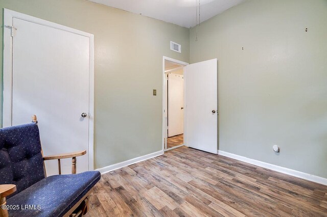 12408 Deerfield Rd, Savannah, GA 31419 - living area featuring wood finished floors, baseboards, and a towering ceiling