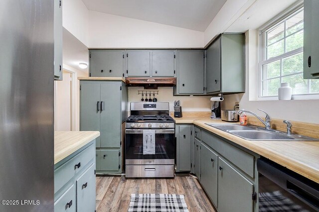 12408 Deerfield Rd, Savannah, GA 31419 - kitchen featuring stainless steel range with gas stovetop, a sink, gray cabinets, black dishwasher, and lofted ceiling