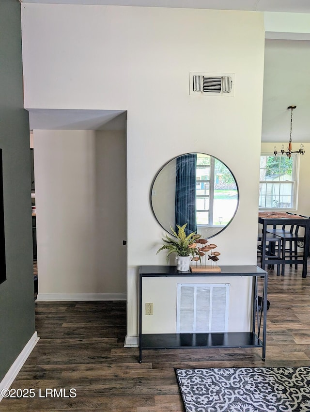 12408 Deerfield Rd, Savannah, GA 31419 - entrance foyer featuring wood finished floors and a chandelier