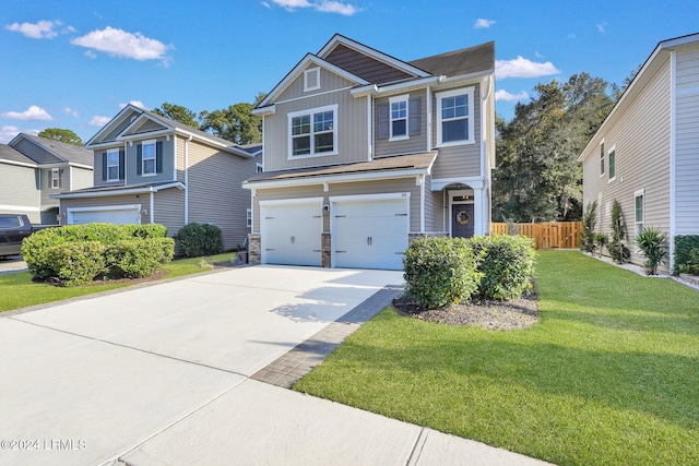 view of front of house featuring a garage and a front yard