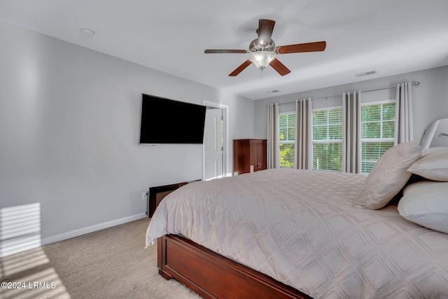 carpeted bedroom featuring ceiling fan