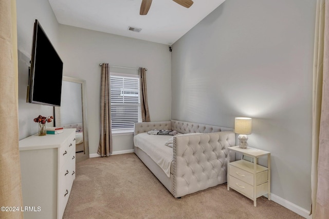 bedroom with light carpet and ceiling fan