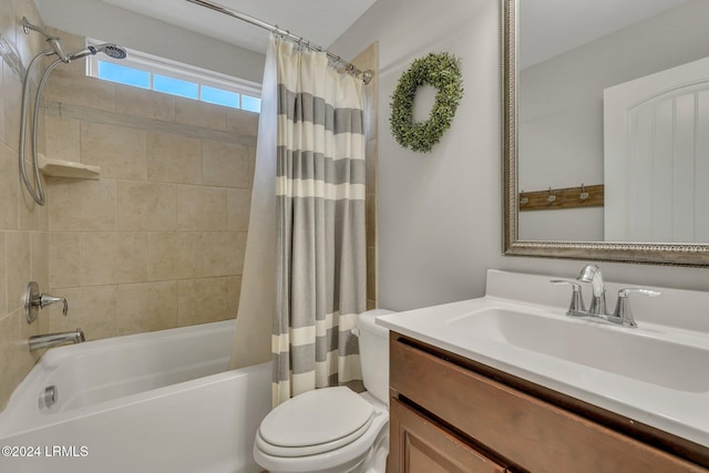 full bathroom featuring vanity, shower / bath combination with curtain, and toilet