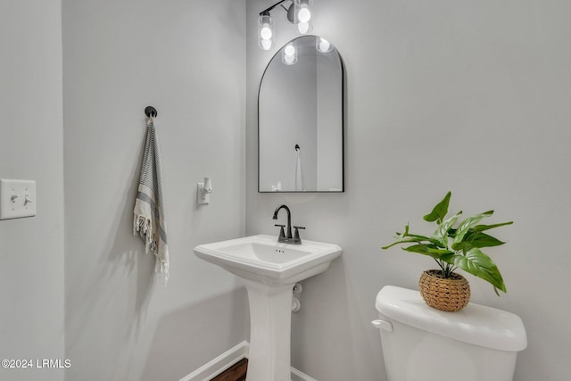 bathroom featuring sink and toilet