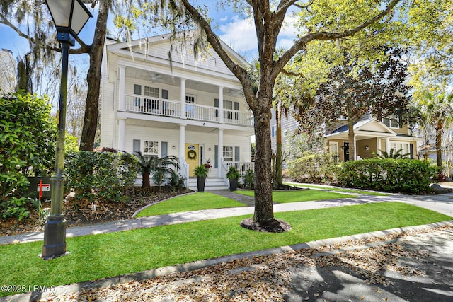 39 Barrington Ave, Bluffton, SC 29910 - neoclassical home featuring covered porch, a balcony, and a front yard
