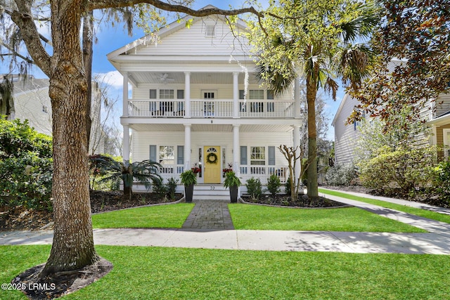 39 Barrington Ave, Bluffton, SC 29910 - greek revival house featuring a porch, a balcony, and a front yard