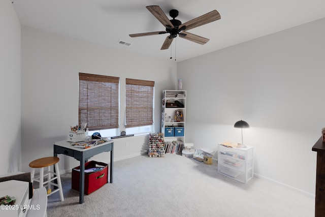 interior space with carpet flooring and ceiling fan