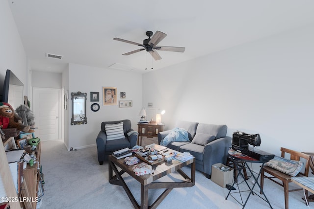 living room featuring light colored carpet and ceiling fan