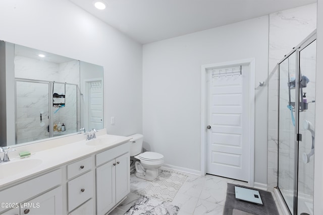 bathroom with vanity, an enclosed shower, and toilet