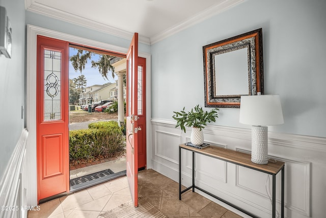 54 Battery Creek Club Dr, Beaufort, SC 29902 - foyer entrance with crown molding, a decorative wall, light tile patterned floors, and wainscoting