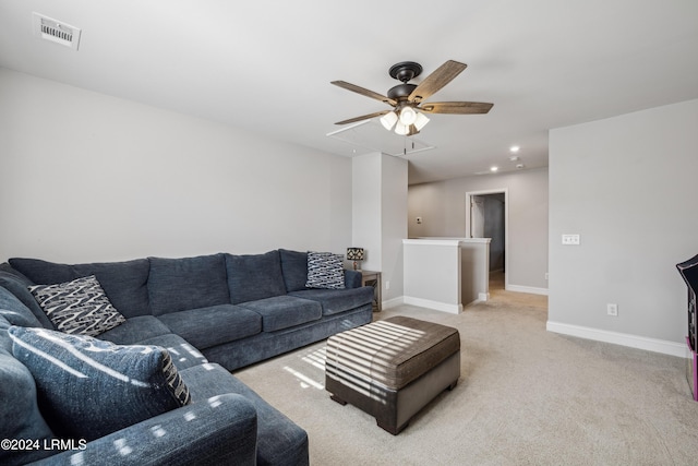 living room featuring light carpet and ceiling fan