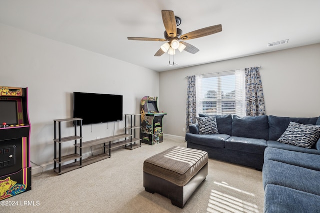 carpeted living room featuring ceiling fan