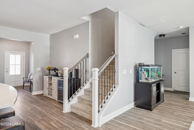 staircase with wood-type flooring