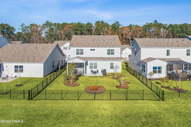 back of property featuring a yard and a patio area