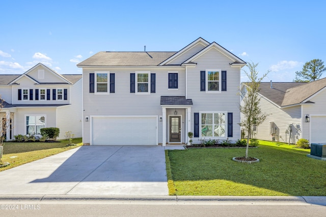 view of front of property with a garage and a front yard