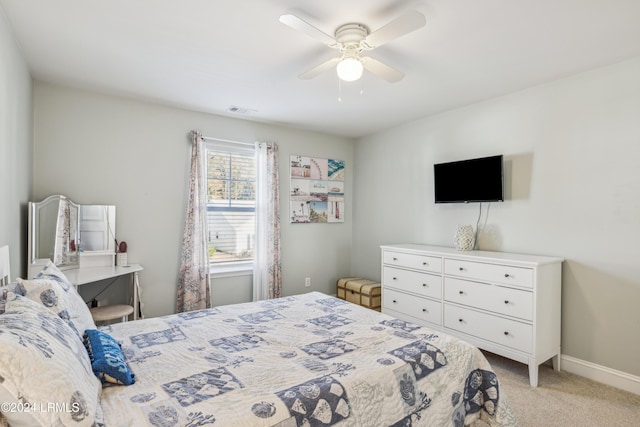 bedroom with light colored carpet and ceiling fan