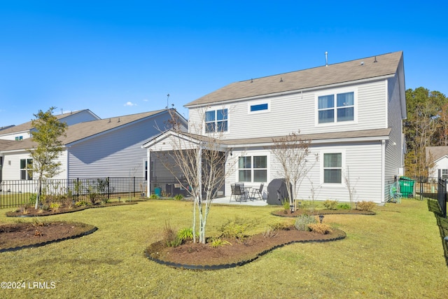 back of house featuring a yard and a patio