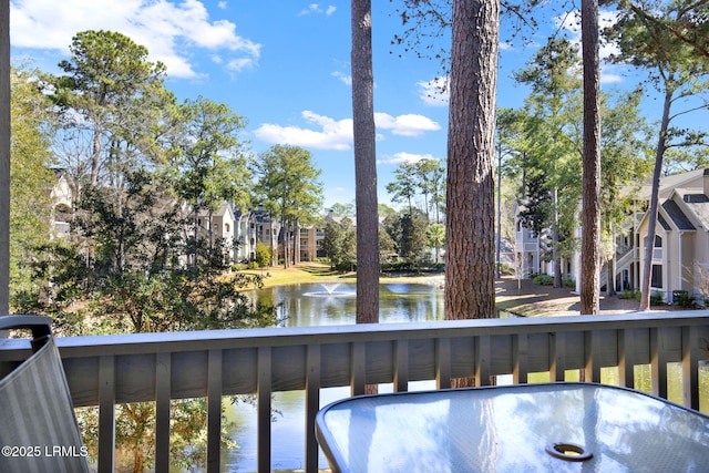 balcony featuring a water view