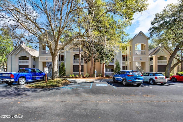 view of property with uncovered parking