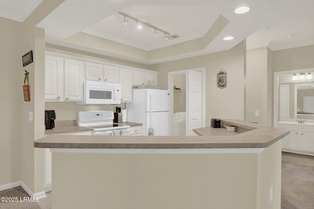 kitchen featuring a tray ceiling, recessed lighting, visible vents, white cabinetry, and white appliances