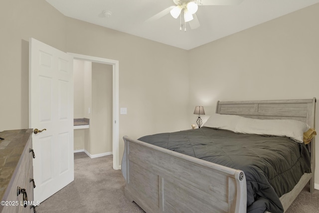 bedroom featuring light carpet, baseboards, and a ceiling fan